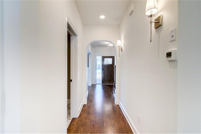 TBB403 College St, Northfield, MN 55057 - hallway with arched walkways, dark wood-style flooring, baseboards, and recessed lighting