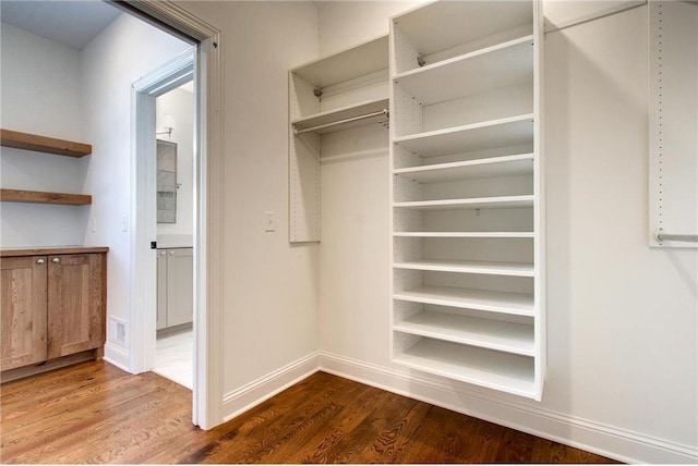 TBB403 College St, Northfield, MN 55057 - walk in closet featuring dark wood-style flooring