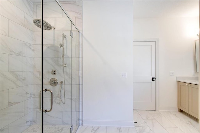 TBB403 College St, Northfield, MN 55057 - bathroom with a stall shower, vanity, baseboards, and marble finish flooring