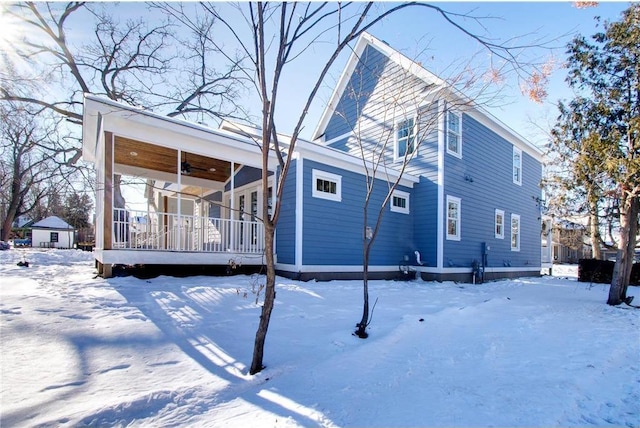 TBB403 College St, Northfield, MN 55057 - snow covered back of property featuring ceiling fan and a wooden deck