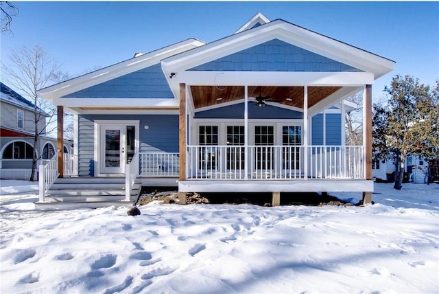 TBB403 College St, Northfield, MN 55057 - snow covered back of property with ceiling fan and covered porch