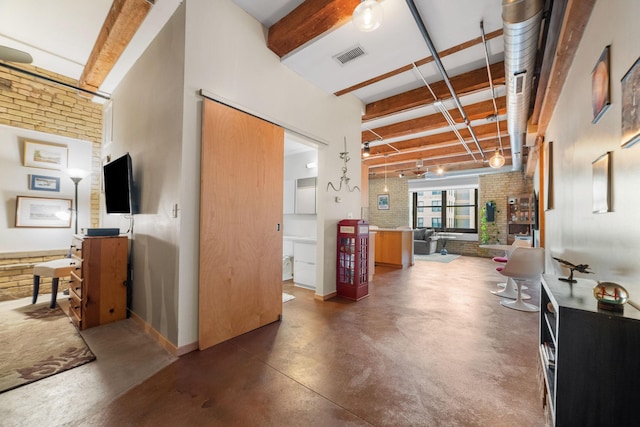 406 Wacouta St Unit 601, Saint Paul, MN 55101 - hallway with finished concrete floors, brick wall, and baseboards