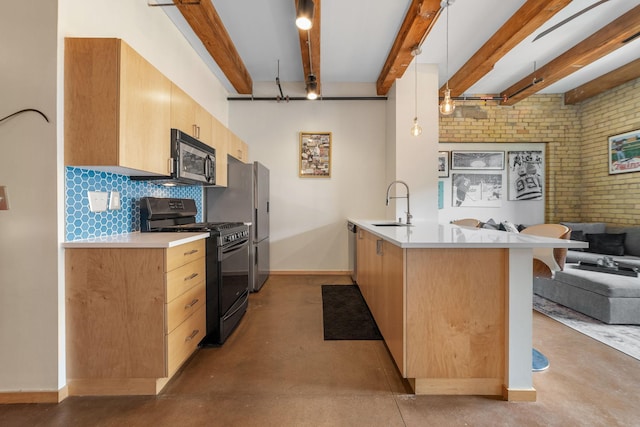 406 Wacouta St Unit 601, Saint Paul, MN 55101 - kitchen featuring appliances with stainless steel finishes, open floor plan, a peninsula, a sink, and concrete flooring