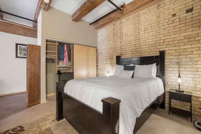 406 Wacouta St Unit 601, Saint Paul, MN 55101 - bedroom with beamed ceiling, a closet, brick wall, and carpet flooring