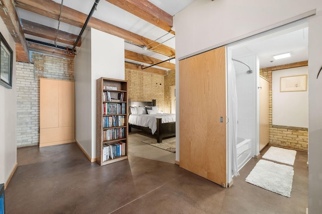 406 Wacouta St Unit 601, Saint Paul, MN 55101 - hall with brick wall and finished concrete floors