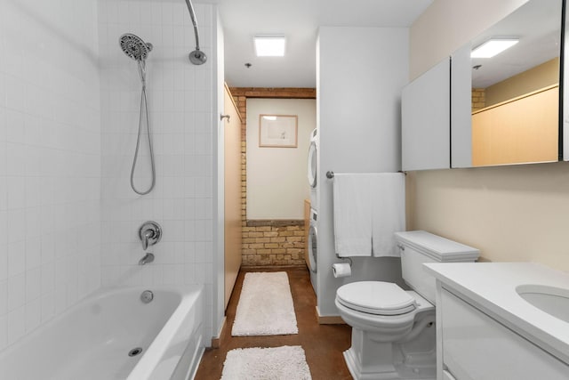 406 Wacouta St Unit 601, Saint Paul, MN 55101 - full bathroom featuring stacked washing machine and dryer, vanity, shower / bathtub combination, and toilet