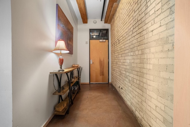406 Wacouta St Unit 601, Saint Paul, MN 55101 - corridor with beam ceiling, finished concrete flooring, and brick wall