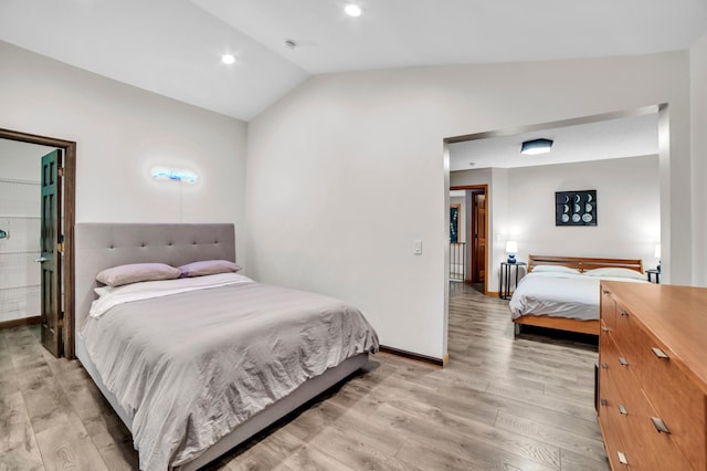 11260 Hidden Oaks Ct N, Champlin, MN 55316 - bedroom with light wood-type flooring, lofted ceiling, baseboards, and recessed lighting