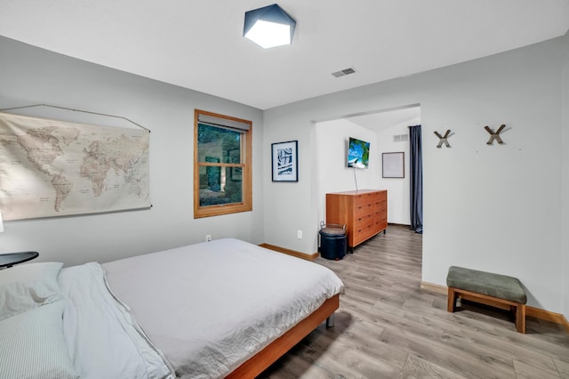 11260 Hidden Oaks Ct N, Champlin, MN 55316 - bedroom featuring light wood-style flooring and baseboards