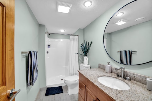11260 Hidden Oaks Ct N, Champlin, MN 55316 - bathroom with toilet, vanity, and a shower with shower curtain
