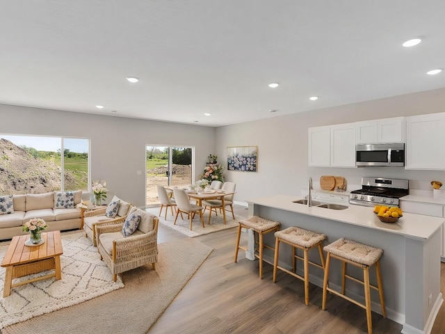 15981 Finale Ave N, Hugo, MN 55038 - living area with light wood-type flooring, recessed lighting, and baseboards