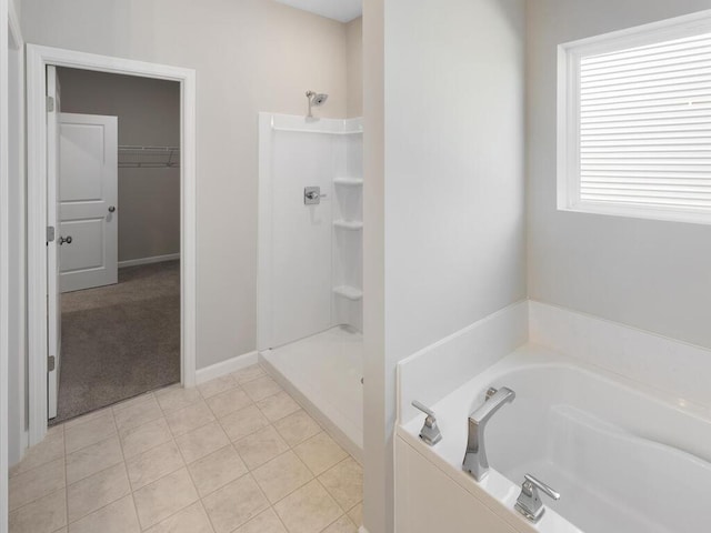 15981 Finale Ave N, Hugo, MN 55038 - full bathroom with a garden tub, a shower, tile patterned flooring, and a walk in closet