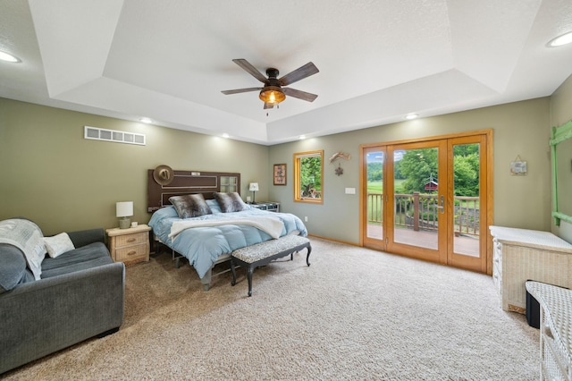 N1931 110th St, Union Twp, WI 54761 - carpeted bedroom with a tray ceiling, access to exterior, recessed lighting, and a ceiling fan