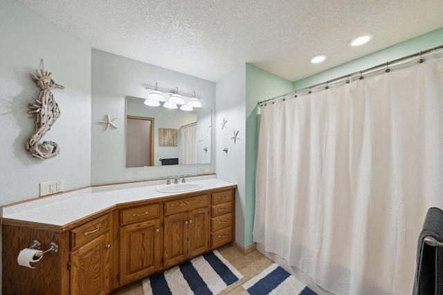 N1931 110th St, Union Twp, WI 54761 - bathroom featuring a textured ceiling, vanity, tile patterned flooring, curtained shower, and recessed lighting