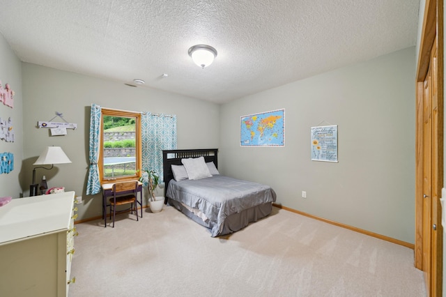 N1931 110th St, Union Twp, WI 54761 - bedroom featuring carpet, baseboards, and a textured ceiling
