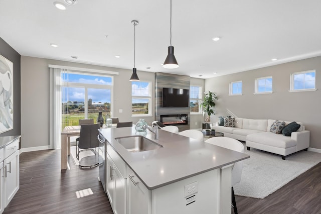 14413 Allerton Way, Rosemount, MN 55068 - kitchen with a sink, dark wood-style flooring, white cabinetry, open floor plan, and recessed lighting