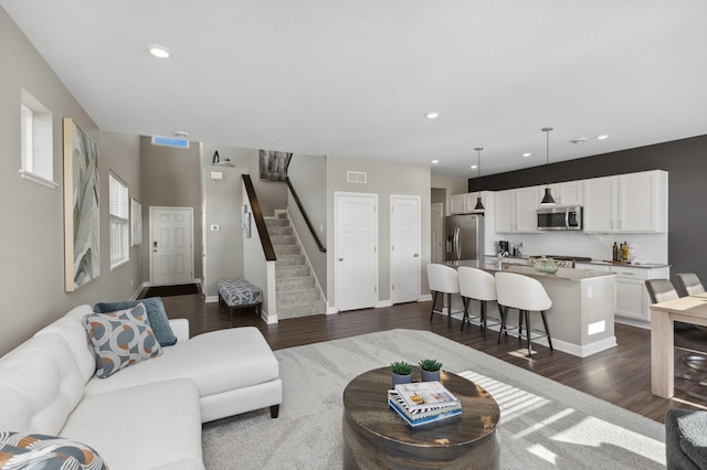 14413 Allerton Way, Rosemount, MN 55068 - living room featuring dark wood finished floors, stairs, recessed lighting, and baseboards