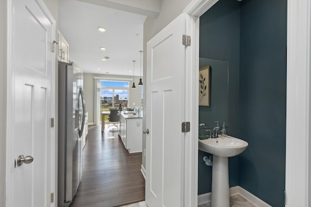 14413 Allerton Way, Rosemount, MN 55068 - hallway with baseboards, dark wood-style flooring, a sink, and recessed lighting