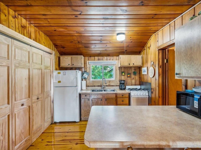 30202 Circle Dr, Breezy Point, MN 56472 - kitchen with white appliances, a sink, light countertops, light wood finished floors, and lofted ceiling