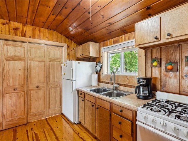 30202 Circle Dr, Breezy Point, MN 56472 - kitchen with white appliances, lofted ceiling, a sink, light countertops, and light wood-type flooring
