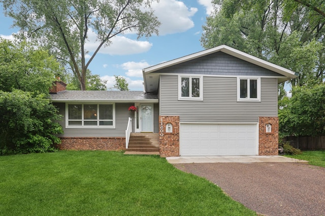 11600 Oberlin Rd, Minnetonka, MN 55305 - tri-level home featuring brick siding, driveway, an attached garage, and a chimney