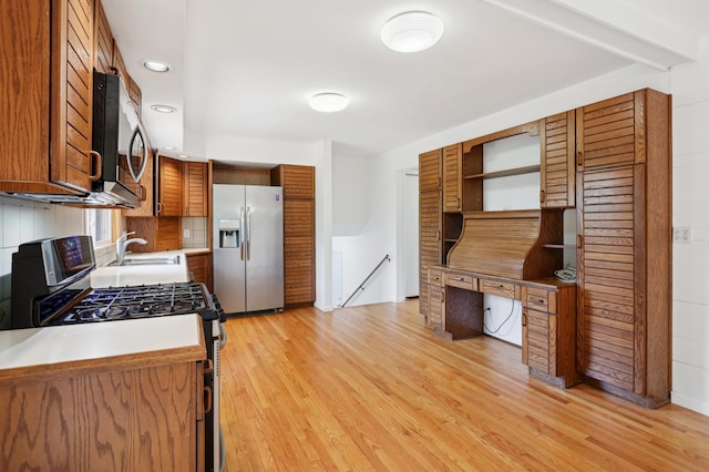 11600 Oberlin Rd, Minnetonka, MN 55305 - kitchen featuring stainless steel appliances, light wood finished floors, open shelves, brown cabinets, and recessed lighting