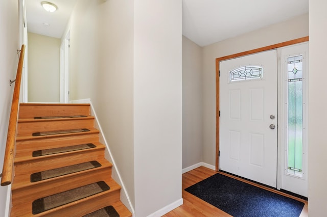 11600 Oberlin Rd, Minnetonka, MN 55305 - entrance foyer featuring wood finished floors, baseboards, and stairs