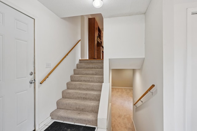 11600 Oberlin Rd, Minnetonka, MN 55305 - stairs with baseboards and carpet flooring
