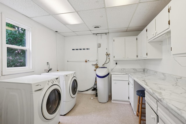 11600 Oberlin Rd, Minnetonka, MN 55305 - washroom featuring washing machine and clothes dryer, cabinet space, and light flooring