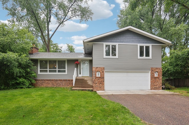 11600 Oberlin Rd, Minnetonka, MN 55305 - split level home featuring brick siding, driveway, an attached garage, and a chimney