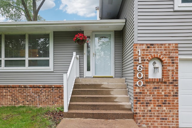 11600 Oberlin Rd, Minnetonka, MN 55305 - property entrance with brick siding and a garage