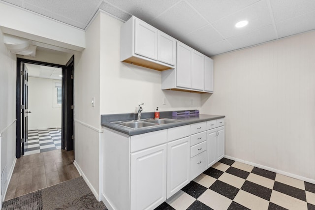 5257 27th Ave S, Minneapolis, MN 55417 - kitchen with a sink, tile patterned floors, and white cabinetry