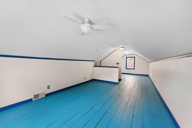 5257 27th Ave S, Minneapolis, MN 55417 - additional living space with baseboards, lofted ceiling, a ceiling fan, and a textured ceiling