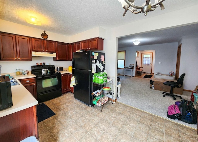 509 Clyde St, West Concord, MN 55985 - kitchen with black appliances, under cabinet range hood, light countertops, a chandelier, and a textured ceiling