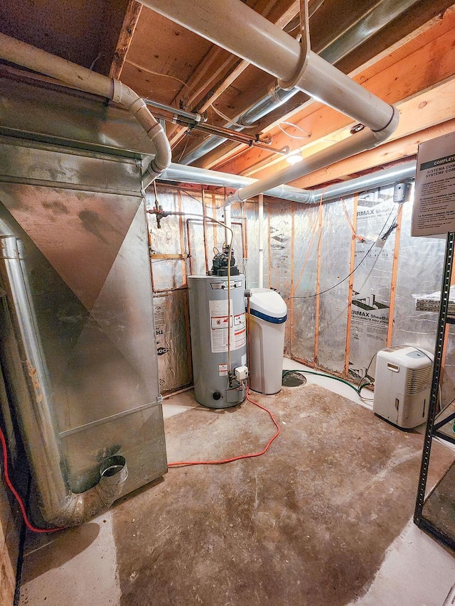509 Clyde St, West Concord, MN 55985 - utility room featuring gas water heater