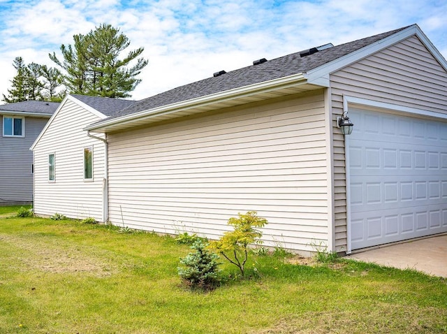 509 Clyde St, West Concord, MN 55985 - view of home's exterior with a garage, a yard, and roof with shingles