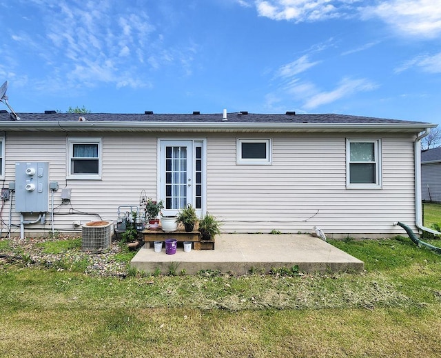 509 Clyde St, West Concord, MN 55985 - back of property with a patio, a yard, and central AC unit
