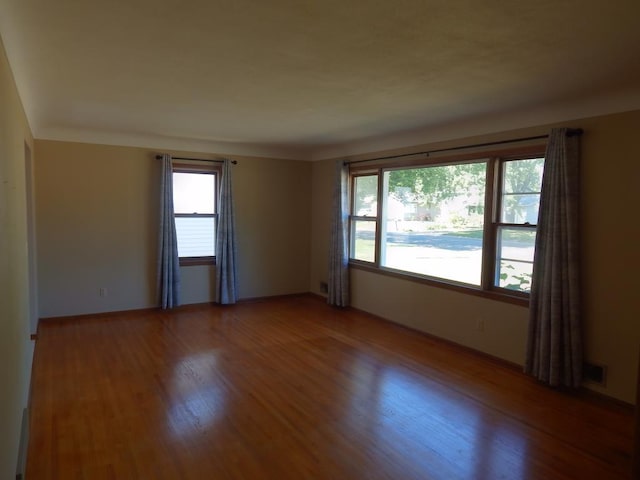 1052 36th Ave N, Saint Cloud, MN 56303 - unfurnished room featuring light wood-style flooring and baseboards