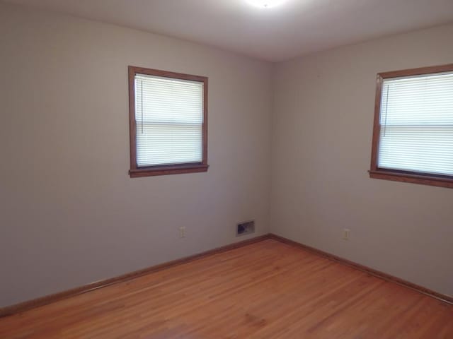 1052 36th Ave N, Saint Cloud, MN 56303 - empty room with light wood-type flooring and baseboards
