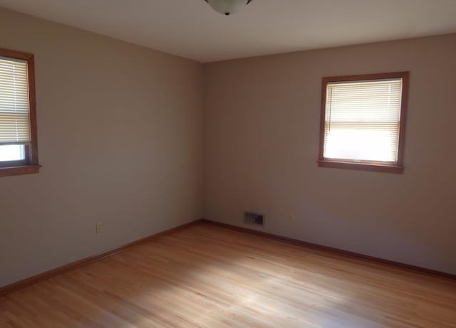 1052 36th Ave N, Saint Cloud, MN 56303 - unfurnished room with light wood finished floors and baseboards