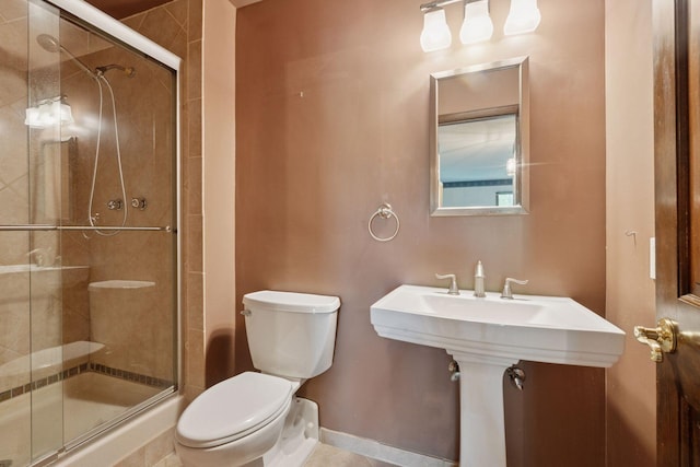 6670 Vernon Ave S Unit 301, Edina, MN 55436 - bathroom featuring toilet, a stall shower, and baseboards