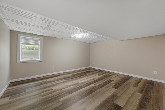 2939 Linden Ave, Slayton, MN 56172 - unfurnished room featuring baseboards, wood finished floors, and an ornate ceiling