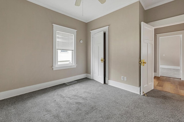 2939 Linden Ave, Slayton, MN 56172 - unfurnished bedroom with carpet floors, crown molding, baseboards, and a ceiling fan