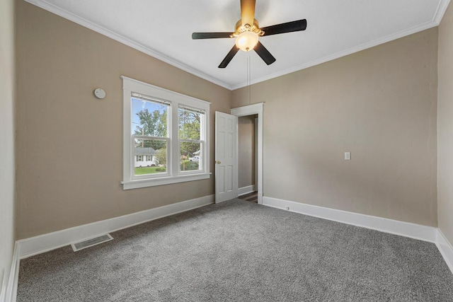 2939 Linden Ave, Slayton, MN 56172 - carpeted empty room featuring baseboards, ornamental molding, and a ceiling fan