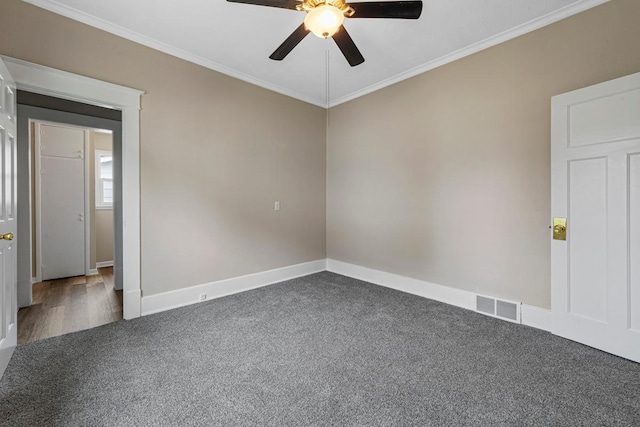 2939 Linden Ave, Slayton, MN 56172 - spare room featuring a ceiling fan, ornamental molding, carpet floors, and baseboards