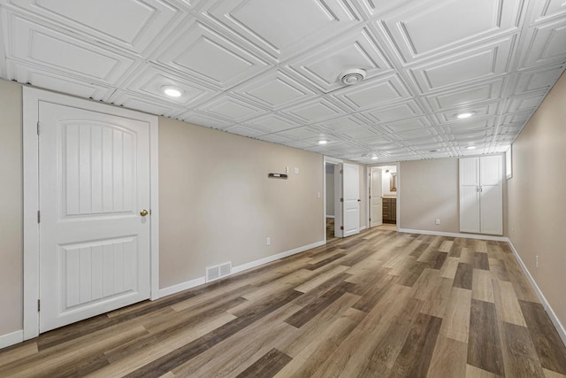 2939 Linden Ave, Slayton, MN 56172 - finished basement with baseboards, an ornate ceiling, recessed lighting, and wood finished floors