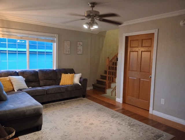 232 2nd St NW, Menahga, MN 56464 - living area featuring wood finished floors, crown molding, stairs, and a ceiling fan