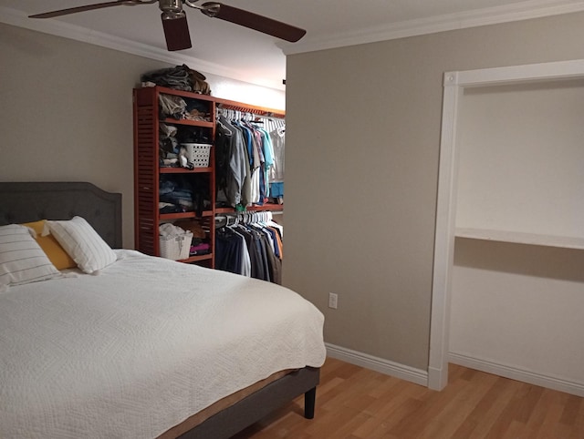 232 2nd St NW, Menahga, MN 56464 - bedroom with light wood-style floors, ornamental molding, a ceiling fan, and a closet