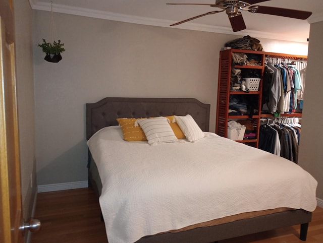 232 2nd St NW, Menahga, MN 56464 - bedroom featuring wood finished floors, crown molding, ceiling fan, and a closet