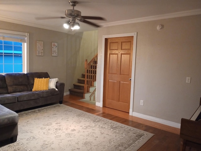 232 2nd St NW, Menahga, MN 56464 - living area featuring wood finished floors, stairway, a ceiling fan, and ornamental molding